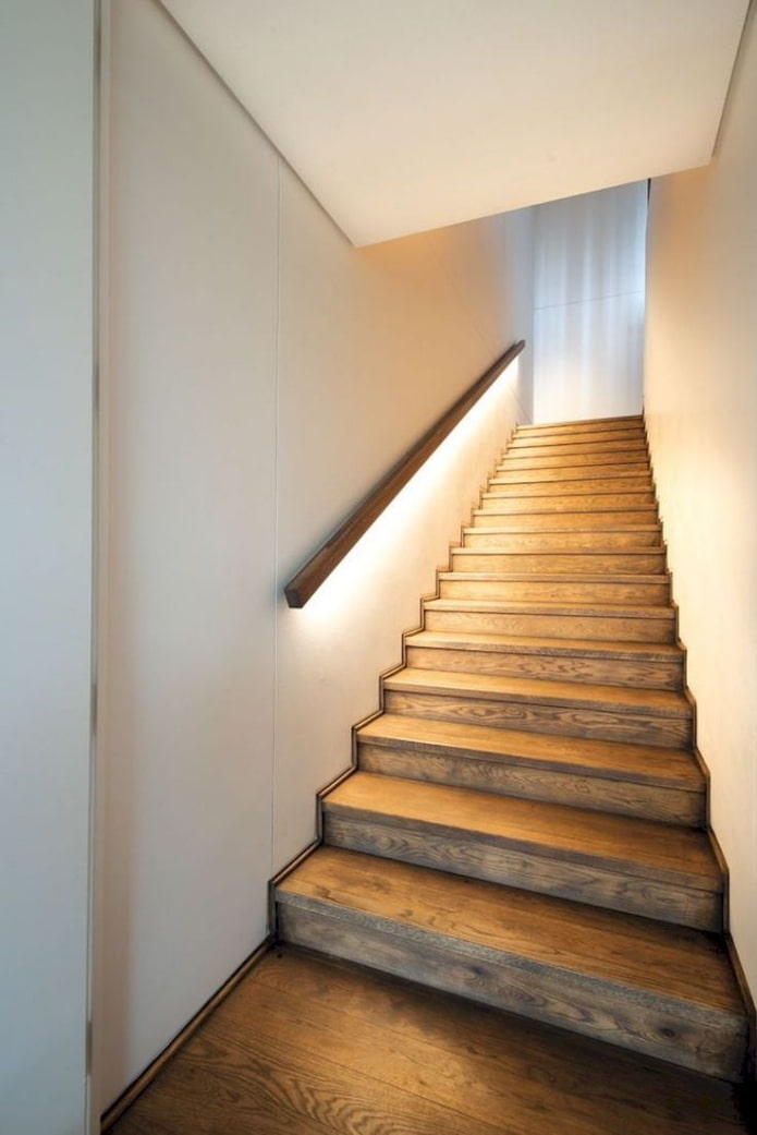 stairs with illuminated railings in the house