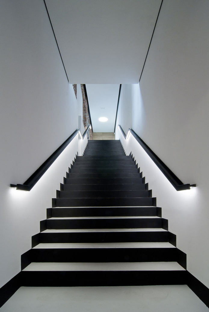 stairs with illuminated railings in the house