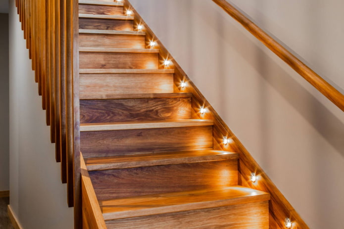 backlit wooden staircase in the interior of the house