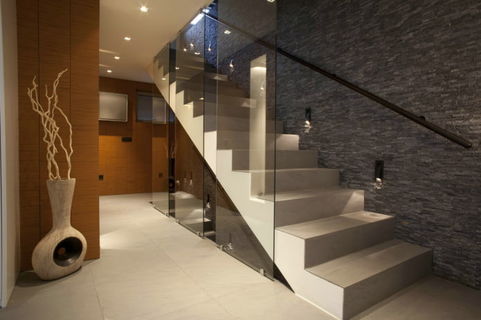 concrete staircase with lighting in the interior of the house