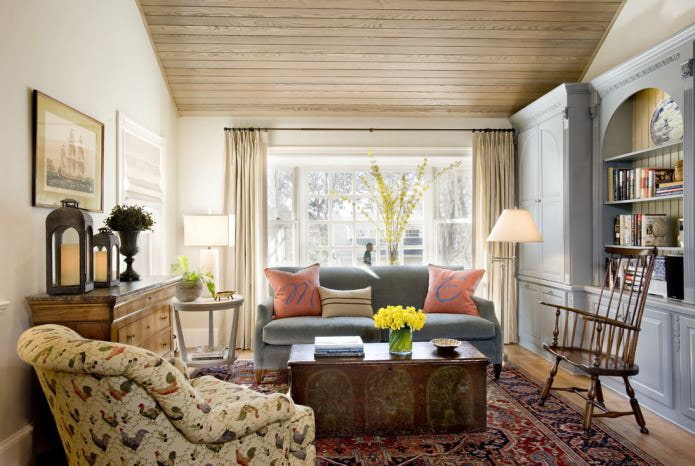 living room interior with a wooden ceiling and plain light walls