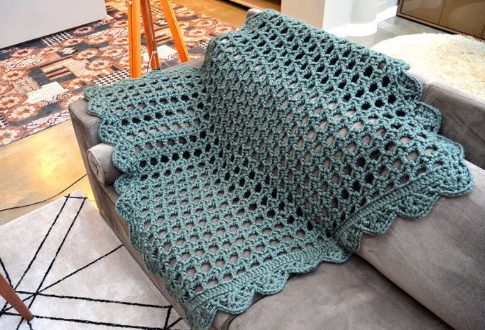 knitted bedspread for a sofa in the interior
