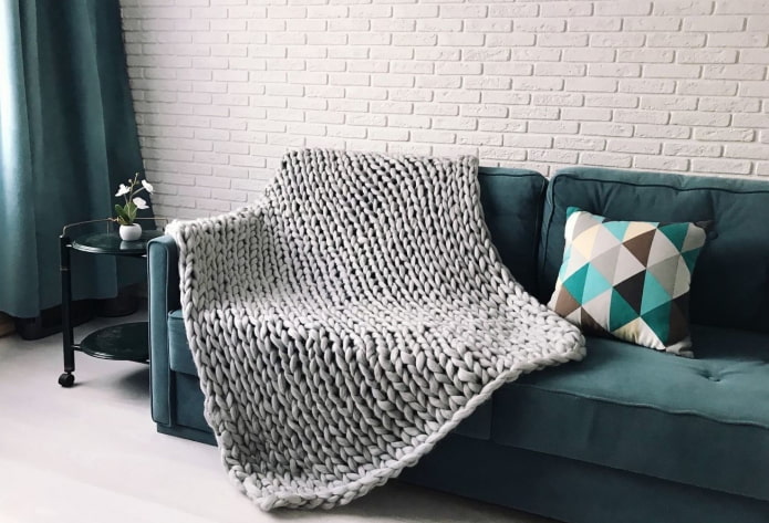 knitted bedspread for a sofa in the interior