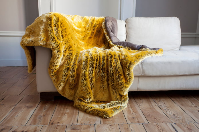 yellow bedspread for a sofa in the interior