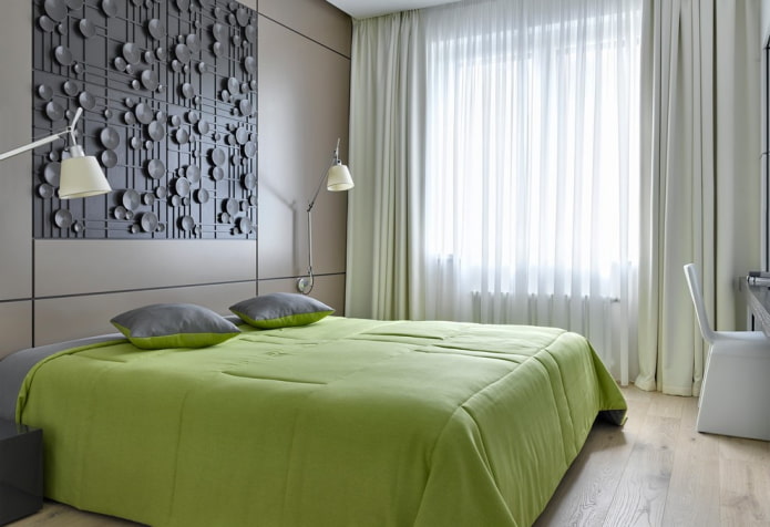 bed with a green bedspread in the bedroom
