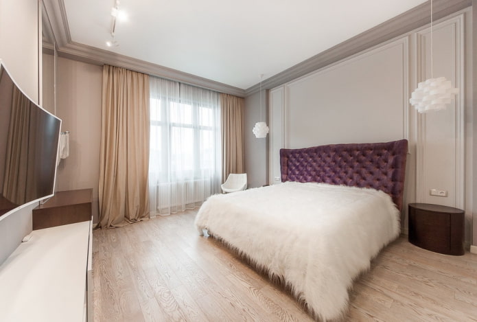 bed with a white bedspread in the bedroom
