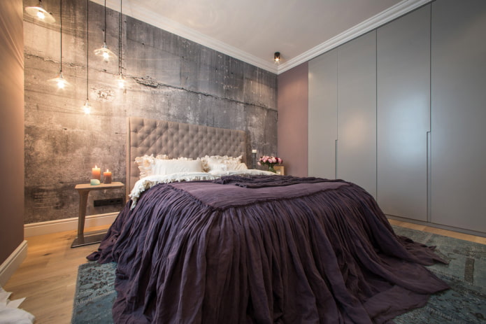 bed with purple bedspread in the bedroom