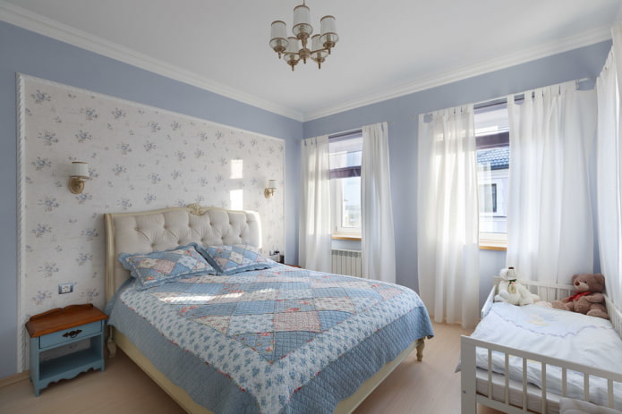 bed with a patchwork bedspread in the bedroom