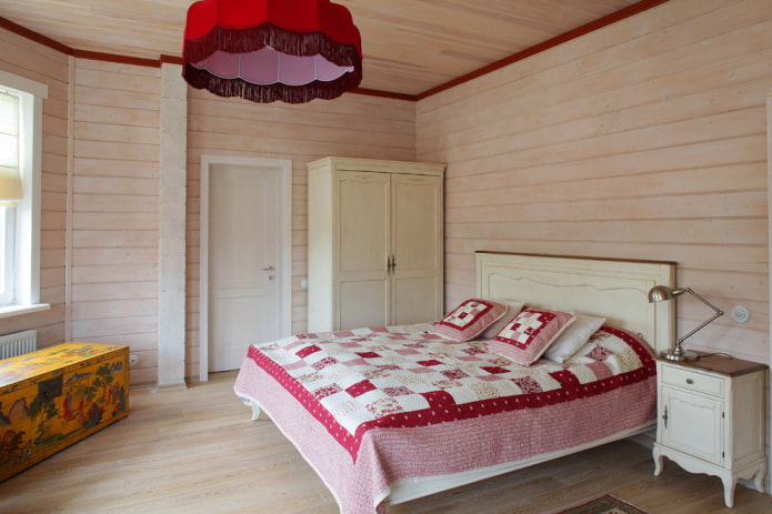 bed with a patchwork bedspread in the bedroom