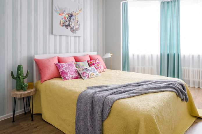 bed with a yellow bedspread in the bedroom