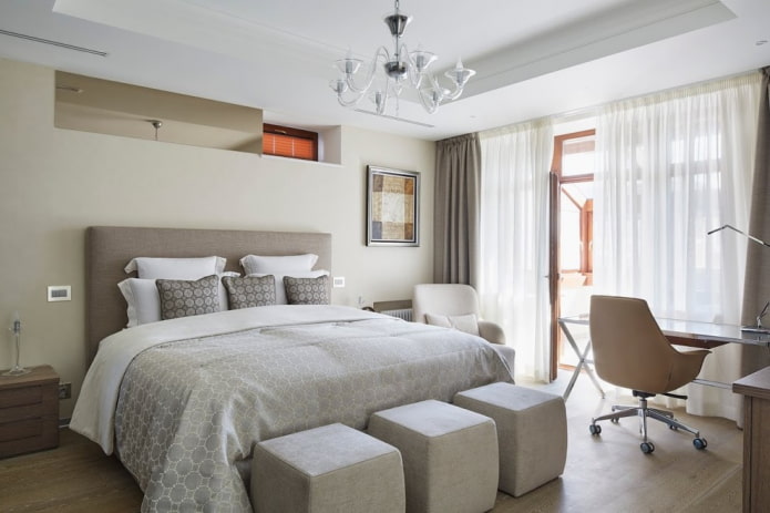 bed with a gray bedspread in the bedroom
