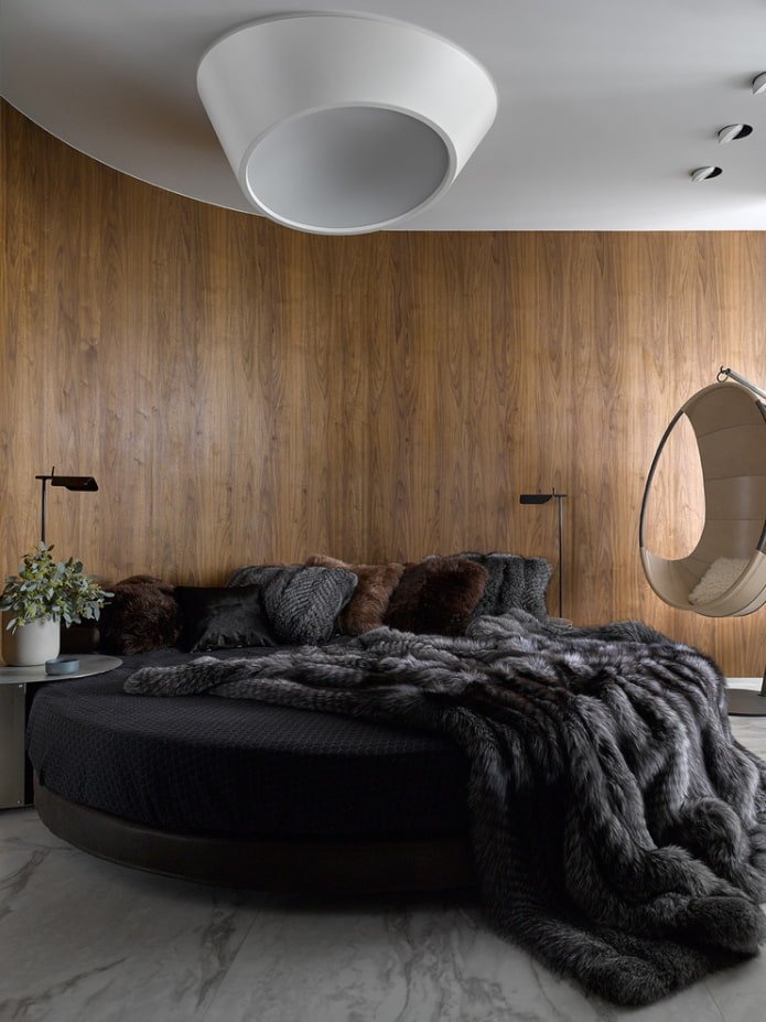 round bed with a bedspread in the interior