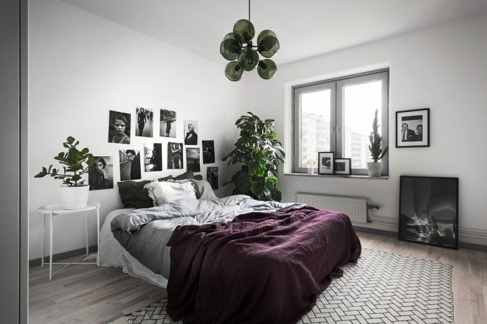 bed with a purple bedspread in the bedroom