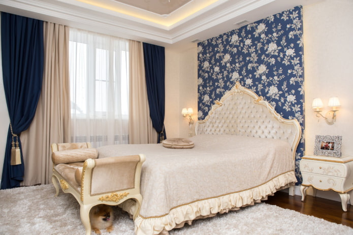 bed with a bedspread with ruffles in the bedroom