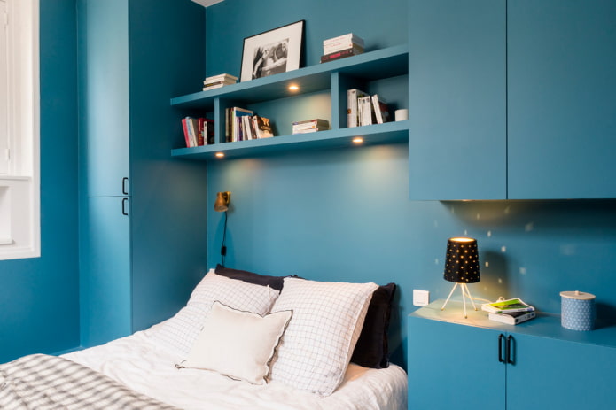 backlit shelves above the bed