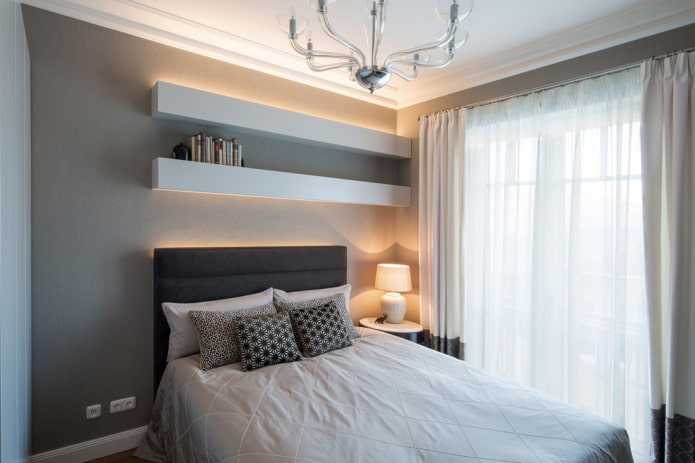 shelves above the bed in bedroom interior