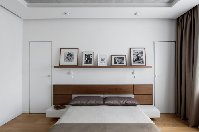 photos on a shelf in the bedroom