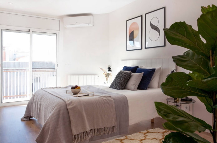 posters at the head of the bed