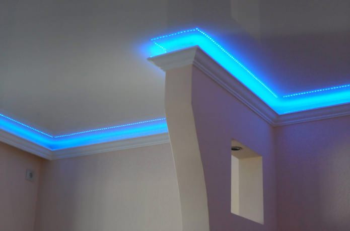 Skirting board with hidden lighting for a stretch ceiling