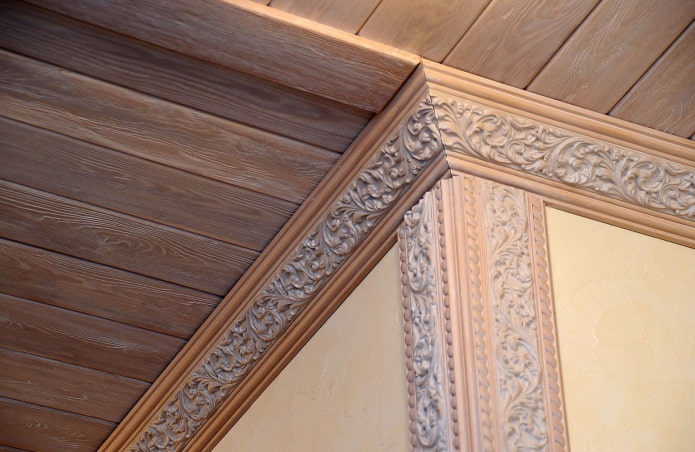 wooden moldings with a ceiling made of clapboard