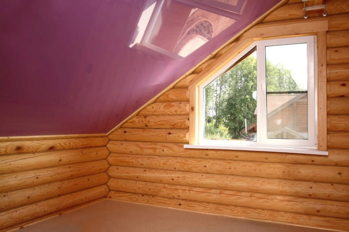 colored glossy stretch ceiling in the attic