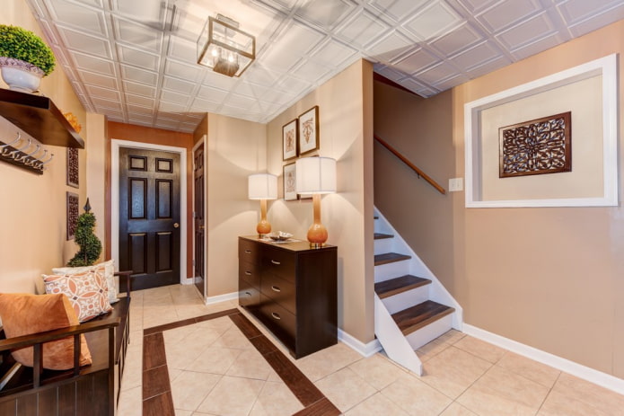 ceiling tiles in the interior of the hallway