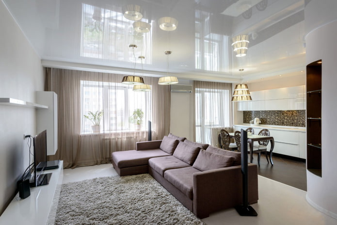 stretch ceiling in the kitchen-living room interior