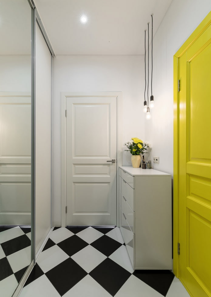 white hallway with a yellow door