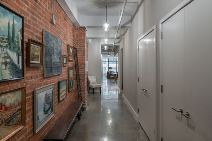 hallway with a brick wall in industrial style