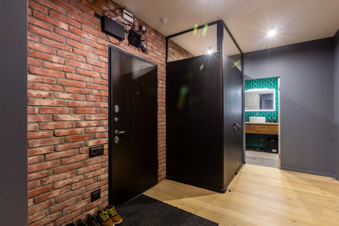 hallway with a brick wall in industrial style