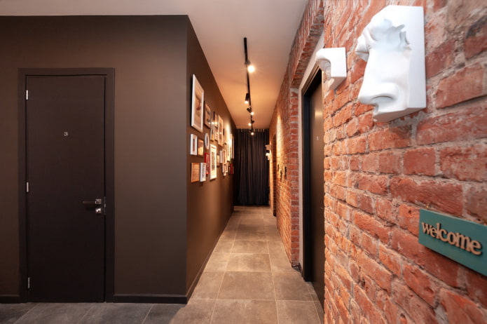 hallway with a brick wall in industrial style