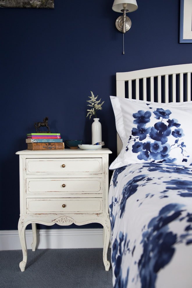 White nightstand on a blue background