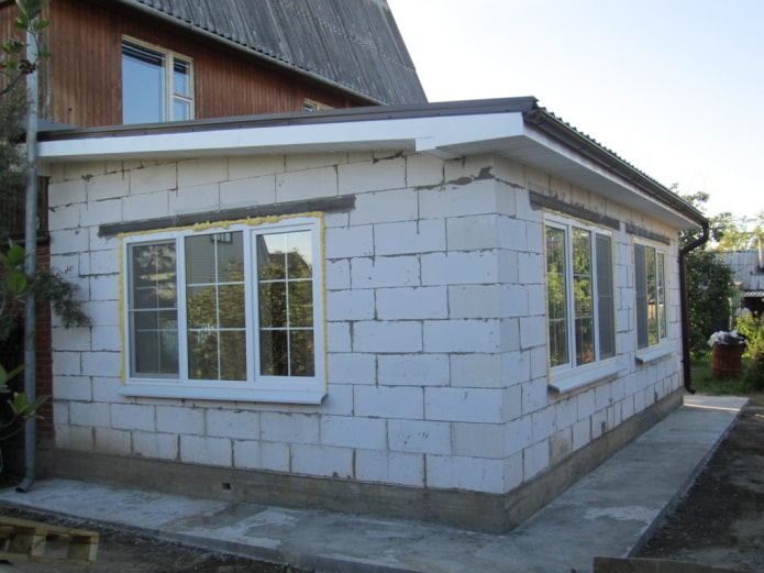 an extension to a wooden house made of foam blocks
