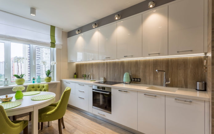 straight kitchen with a dining table