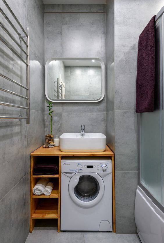 washing machine under the sink with shelves