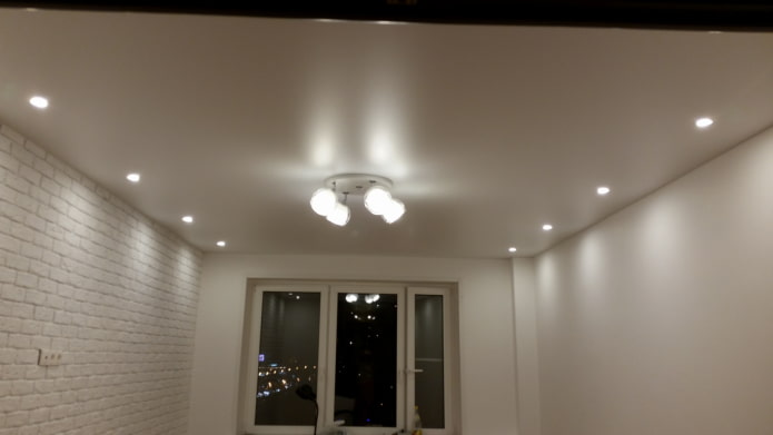 lamps along the walls on the ceiling