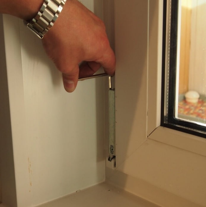 PVC window lower hinge adjustment