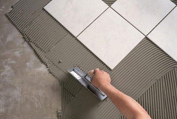 Laying floor tiles