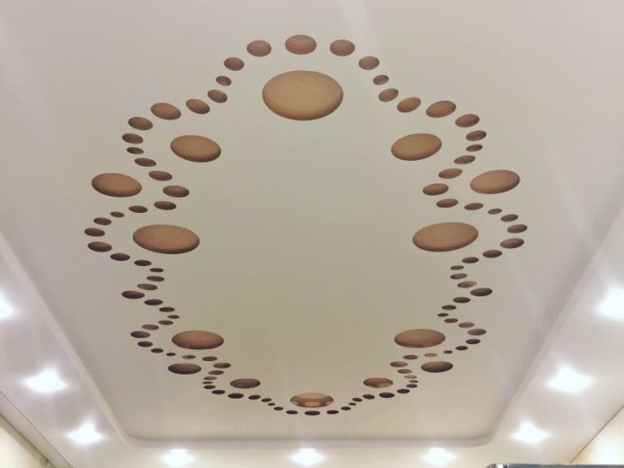 stretched ceiling with perforation in the form of patterns
