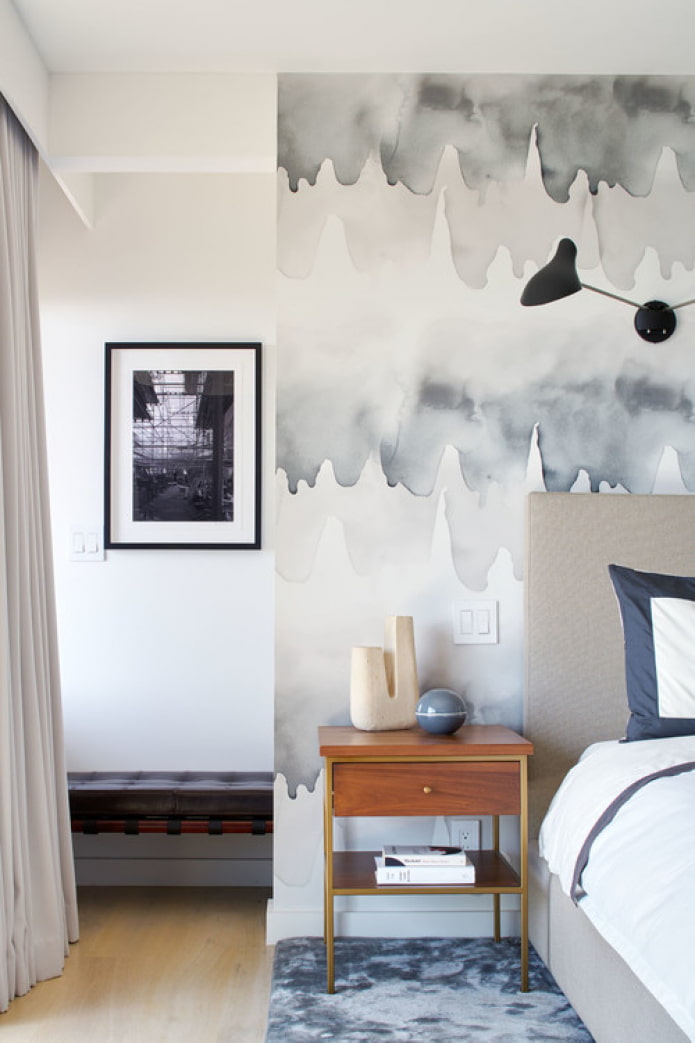 painting on the wall behind the bed