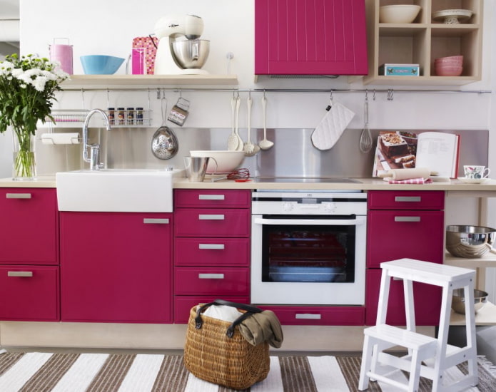 furniture and appliances in the kitchen interior in pink tones