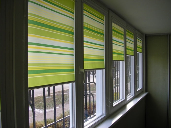 roller blinds with striped print on the loggia