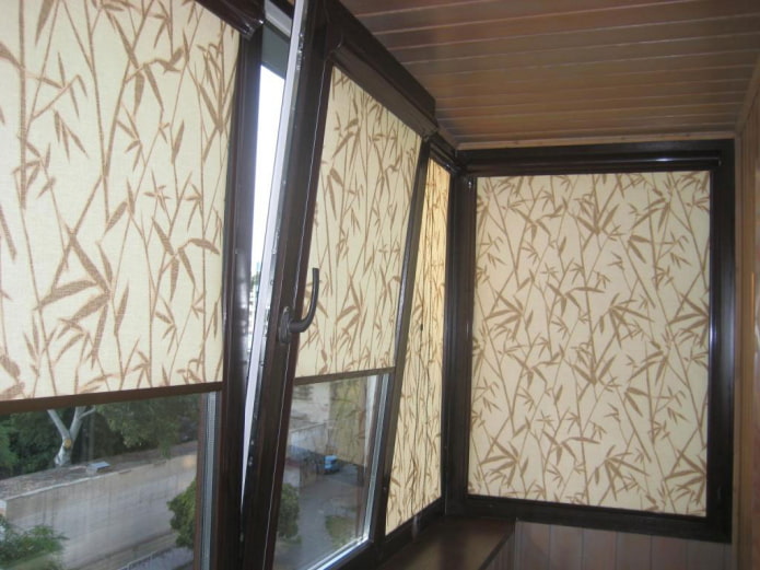 beige roller blinds with a pattern on the loggia