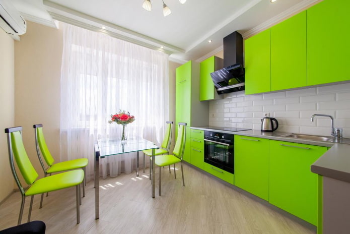 furniture and appliances in the kitchen interior in light green tones