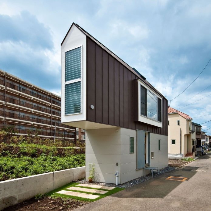 narrow house in Tokyo during the day