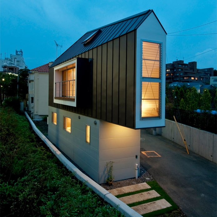 narrow house in Tokyo at night
