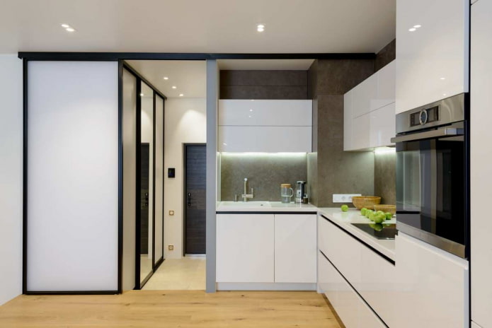 small kitchen with gray walls, light wooden floor and white furniture