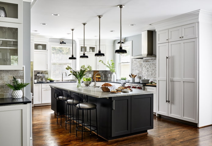 bright yellow-brown wooden floor in a gray and white kitchen