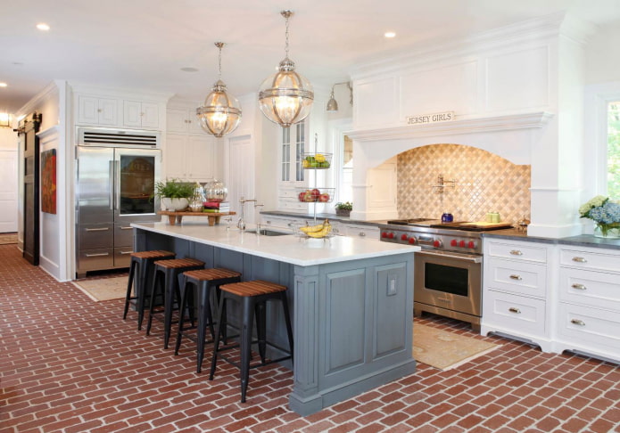floor in a gray and white kitchen in the form of red brickwork