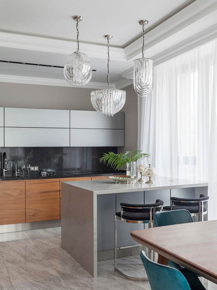 wooden cabinets, original lamps and turquoise chairs in a gray and white kitchen